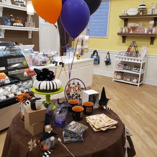 a table with balloons and decorations