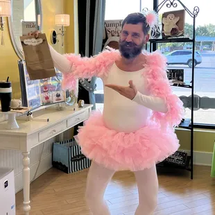 When your cake pick-up turns into an audition for Swan Lake...  Mitch Allen in pink tutu and questioning life choices.