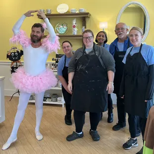 Group photo with the real star of the day! Mitch, showing off his best &apos;I&apos;m ready for my close-up&apos; ballerina pose. The staff laughing!