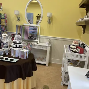 a room with a table and a mirror