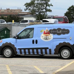 a blue van in a parking lot