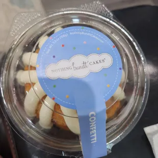 a cupcake in a plastic container