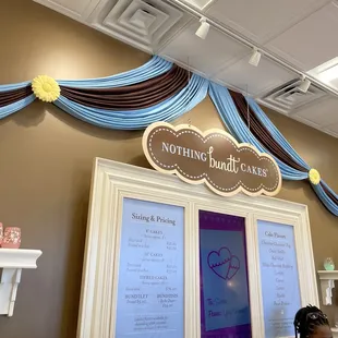 a woman standing in front of a sign