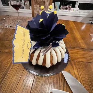 a bundt cake on a table with a knife