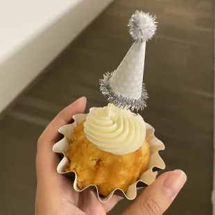 a person holding a bundt cake