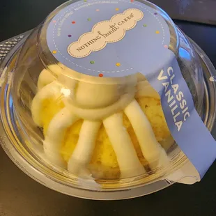 a bundt cake in a plastic container