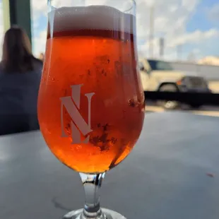 a glass of beer on a table