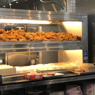 Wall of fried chicken + biscuits ready to be served.