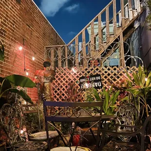 a patio with a table and chairs