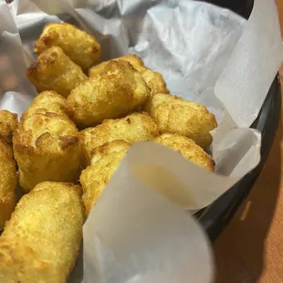 a basket of fried tater tots