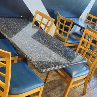 a table and chairs in a restaurant