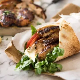 CHICKEN SHAWARMA SANDWICH WRAPPED IN PITA BREAD