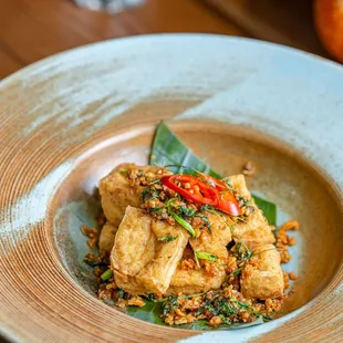 Crispy Deep-fried tofu mixed with chili, garlic, scallion, cilantro and kaffir lime leaves