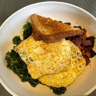 an omelet with toast and vegetables