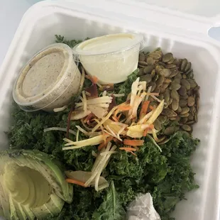 a salad in a styrofoam container