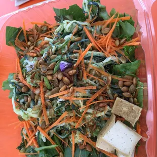 Cucumber "noodle" salad with cashew cheese instead of avocado on top