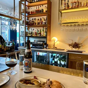 a plate of food and a glass of wine
