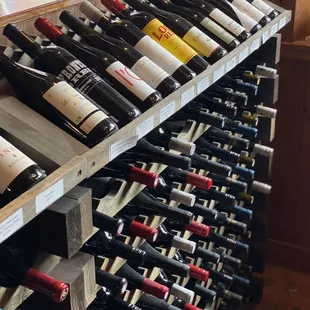a wine rack full of wine bottles
