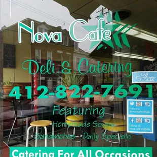 the front window of a cafe