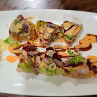 a plate of food on a wooden table