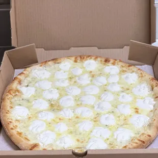 White pizza with extra ricotta