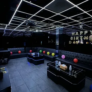 a black room with neon lights