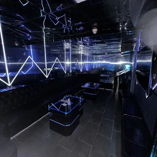 a black room with neon lights