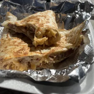 Brisket Quesadillas w/rice, beans and loaded with cheese.