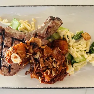 Center Cut Duroc Pork Chop* spicy pork belly braise, baby bok choy, rice spaetzle, crispy shallots