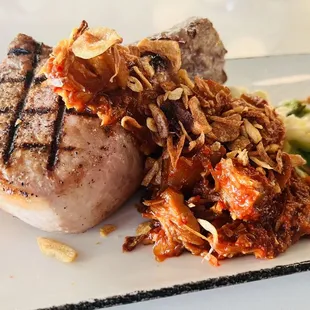 Center Cut Duroc Pork Chop* spicy pork belly braise, baby bok choy, rice spaetzle, crispy shallots