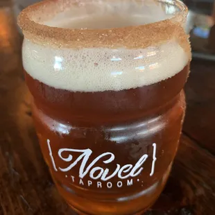 a glass of beer on a table