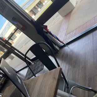 a person sitting at a table with a laptop