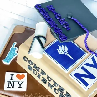 a graduation cake with a graduation cap on top