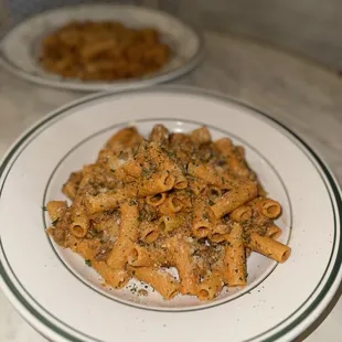 a plate of pasta and a bowl of pasta