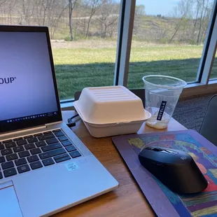 a laptop and a mouse on a table