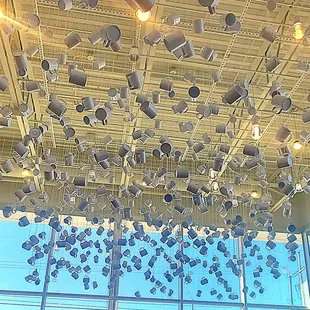 a view of a large building with a lot of coffee cups hanging from the ceiling