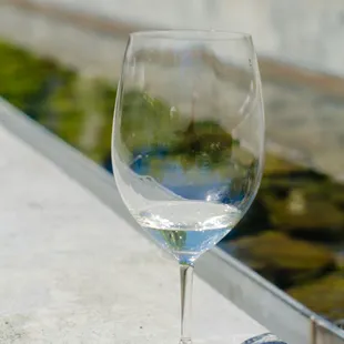 a wine glass on a ledge