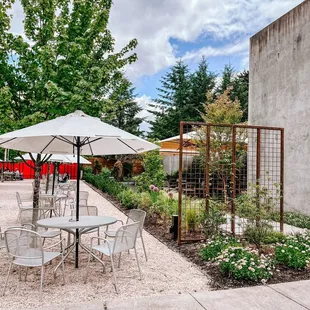 a patio with tables and chairs