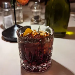 a glass of soda and a bottle of wine