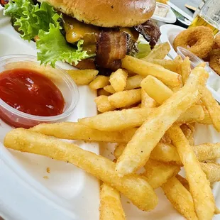 a burger and fries on a plate