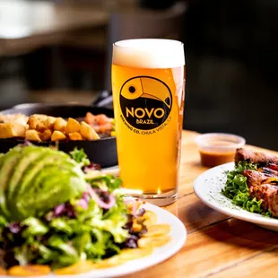 a plate of food and a glass of beer