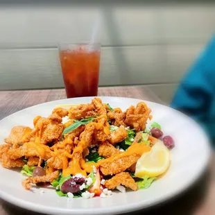 Calamari Salad; iced tea with sugar.
