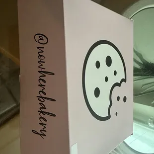 a pink box with a smiley face on it