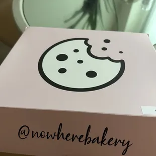 a pink box with a smiley face on it