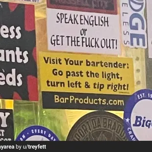 Bigoted sticker behind the bar.