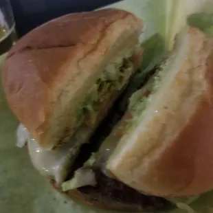 a hamburger with lettuce and cheese