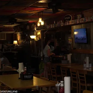 people sitting at tables in a restaurant