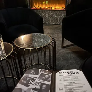 a fireplace and chairs