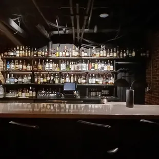 a bar with bottles of alcohol