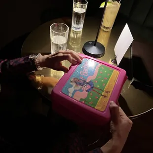 a person cutting a cake